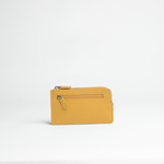 Portachiavi in pelle martellata colore giallo senape artigianale Aut Aut Studio – vista frontale