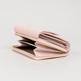 Midi wallet in hammered leather, blush color, handcrafted by Aut Aut Studio – side view