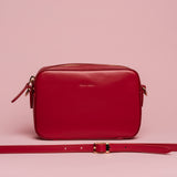 Mini borsa con tracolla in pelle liscia colore ciliegia artigianale Aut Aut Studio – vista frontale
